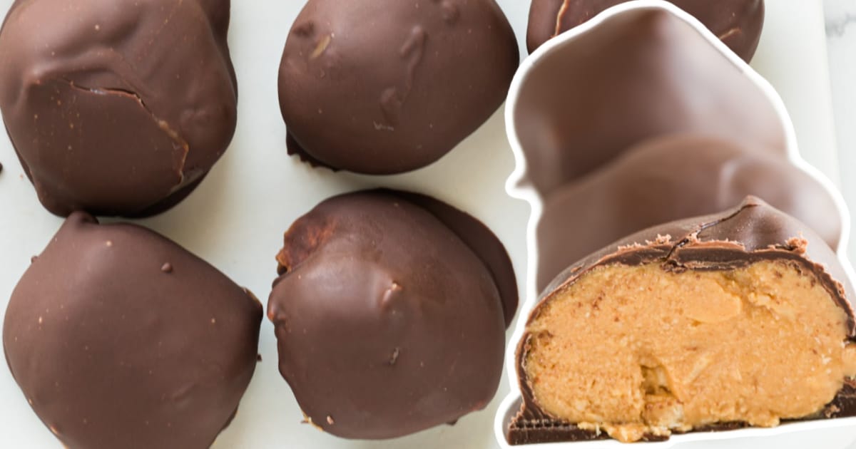 Peanut butter balls on parchment paper beside a keto peanut butter ball split open.