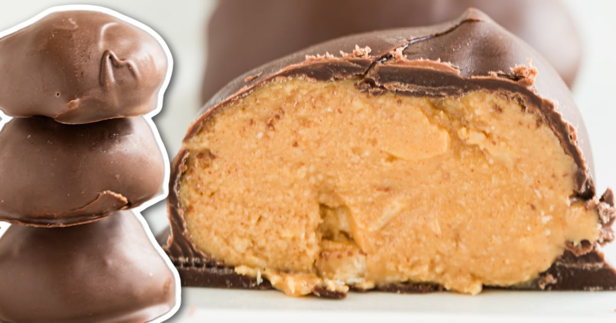 A stack of peanut butter balls beside a peanut butter ball split in half.