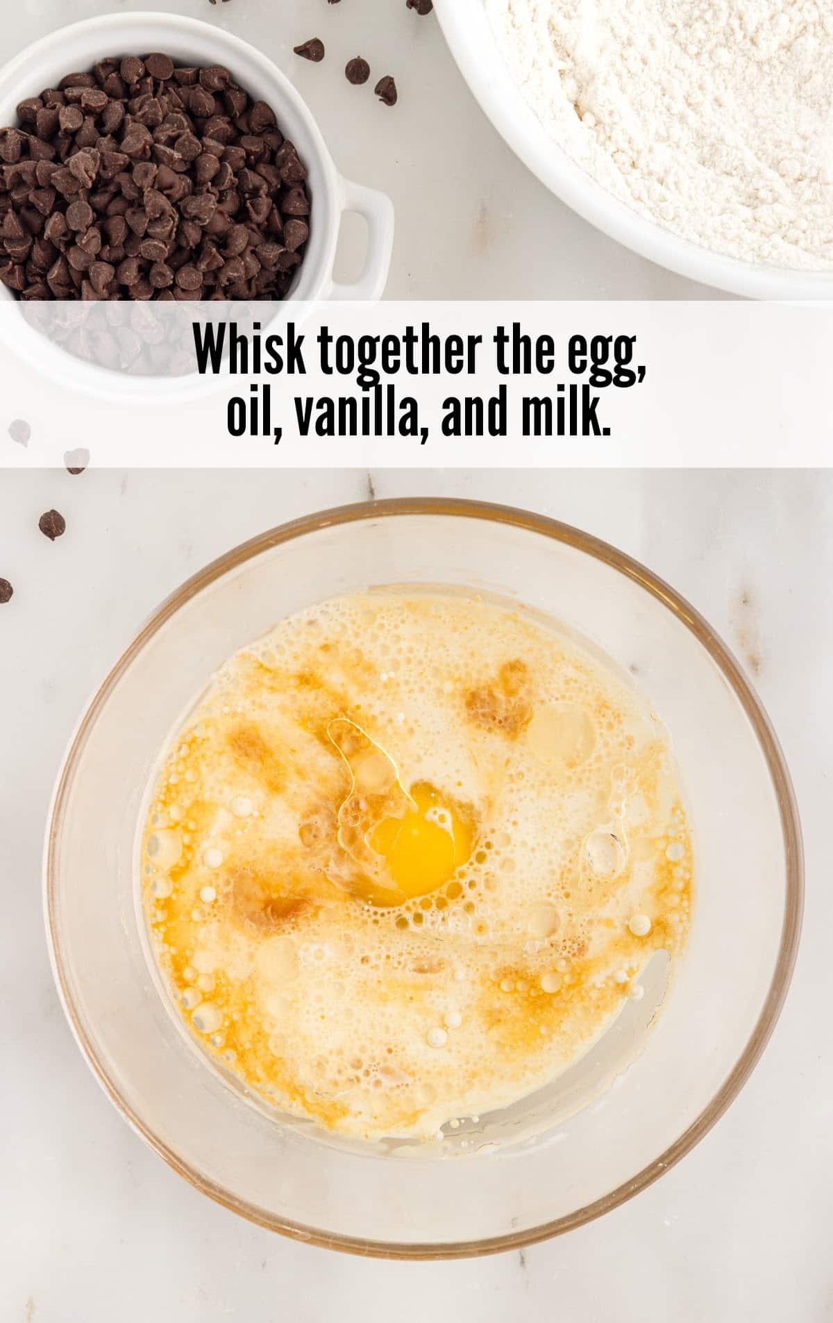 egg, oil, vanilla and milk mixed in a bowl