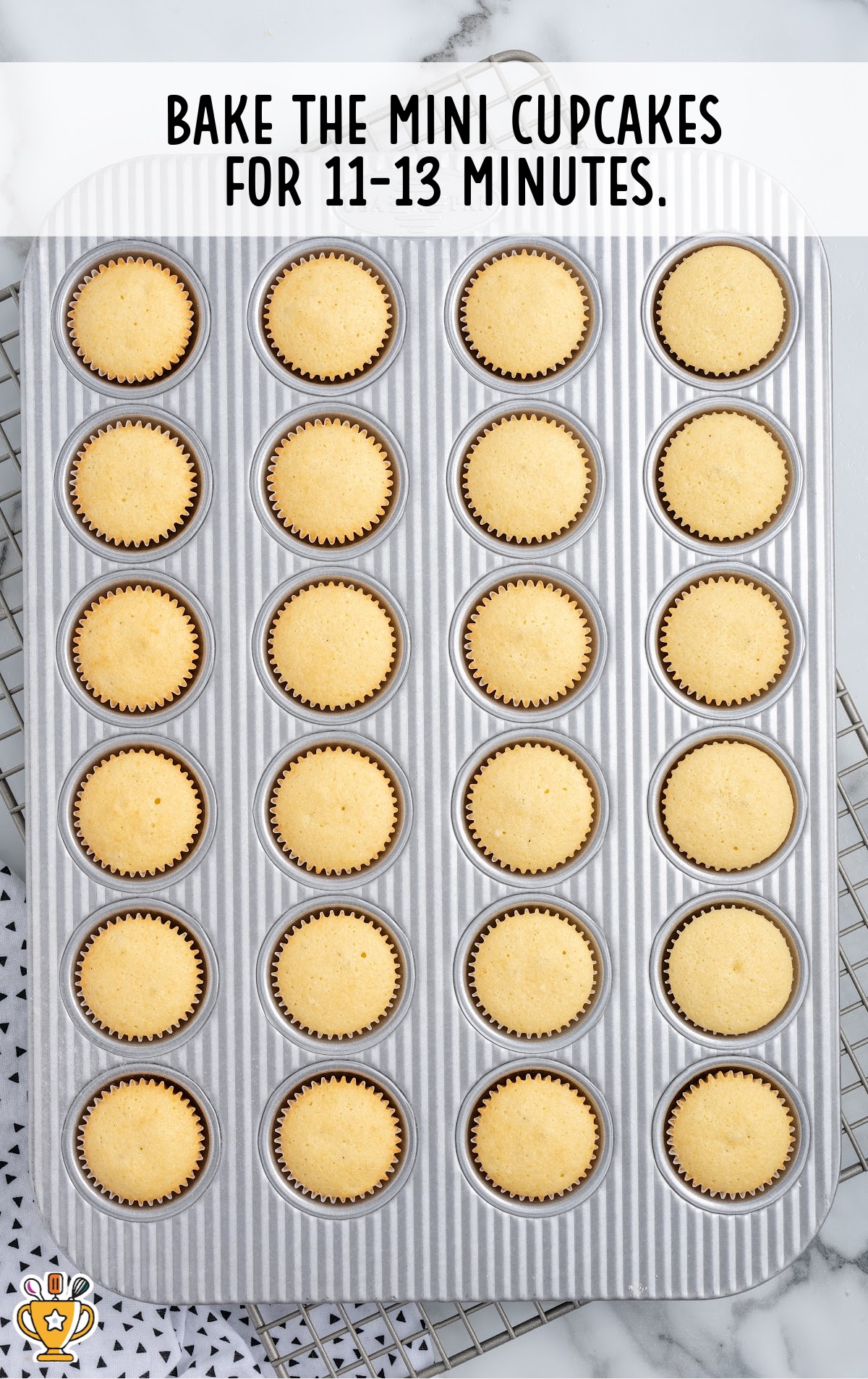 A mini cupcake pan full of baked mini cupcakes.
