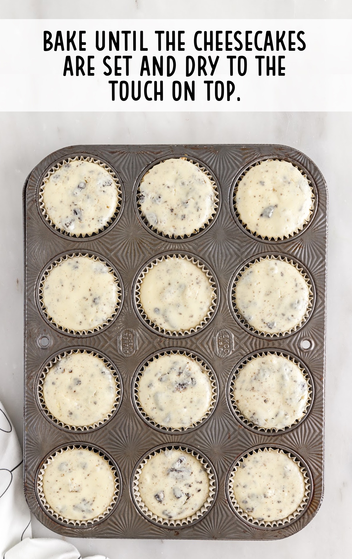 Baked Mini Oreo Cheesecake in a muffin pan