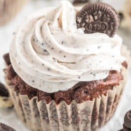 An Oreo cupcake with a wrapper still on.