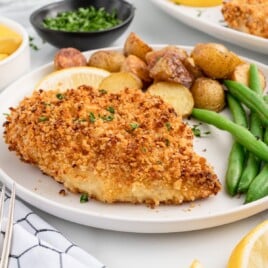 Panko Chicken with green beans and potatoes on a plate
