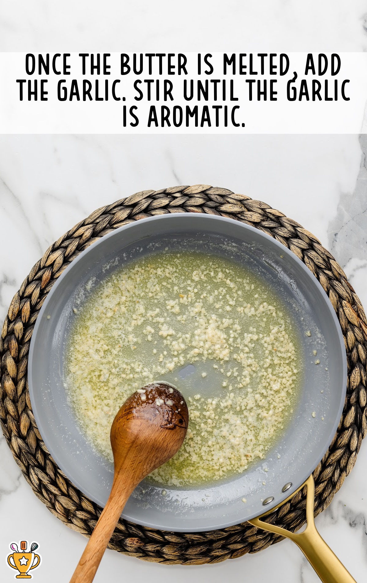 Butter and garlic melted in a pan.