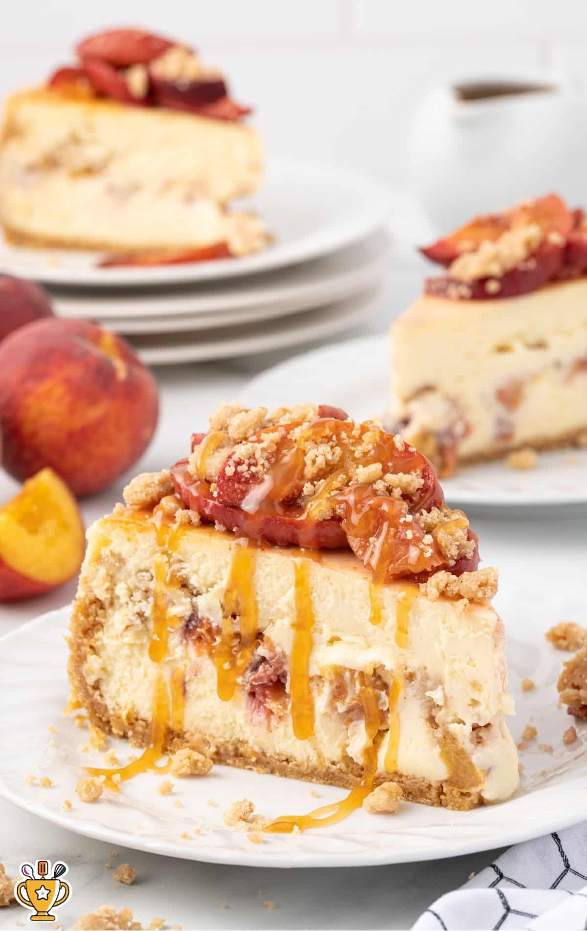 a piece of Peach Cobbler Cheesecake on a plate