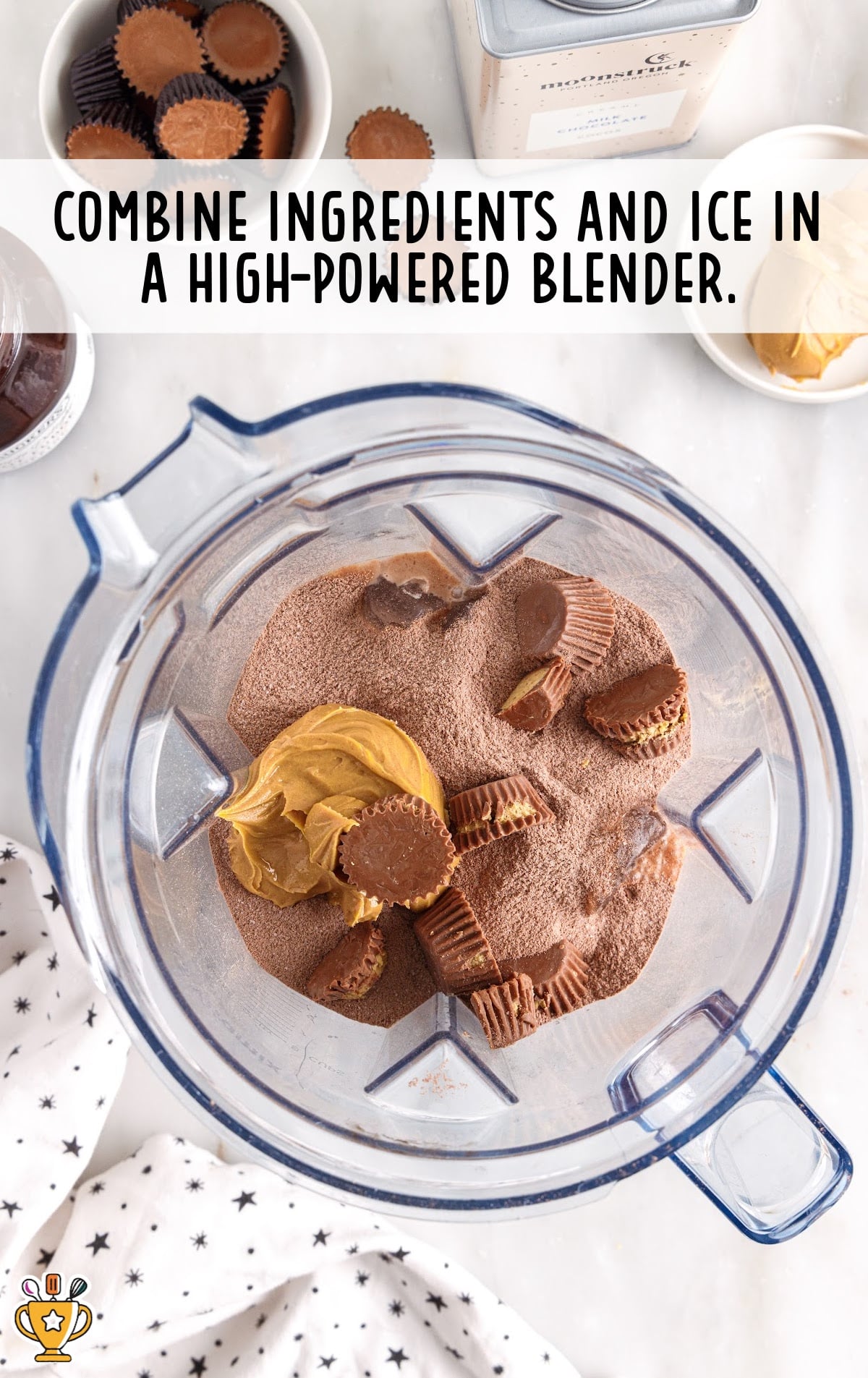 Frozen Peanut Butter Hot Chocolate ingredients and ice in a blender