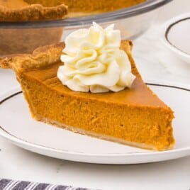 A plate served with a piece of Pumpkin Pie