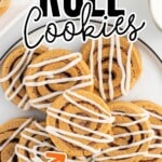 Pumpkin Roll Cookies on a plate with the icing drizzle on top of them
