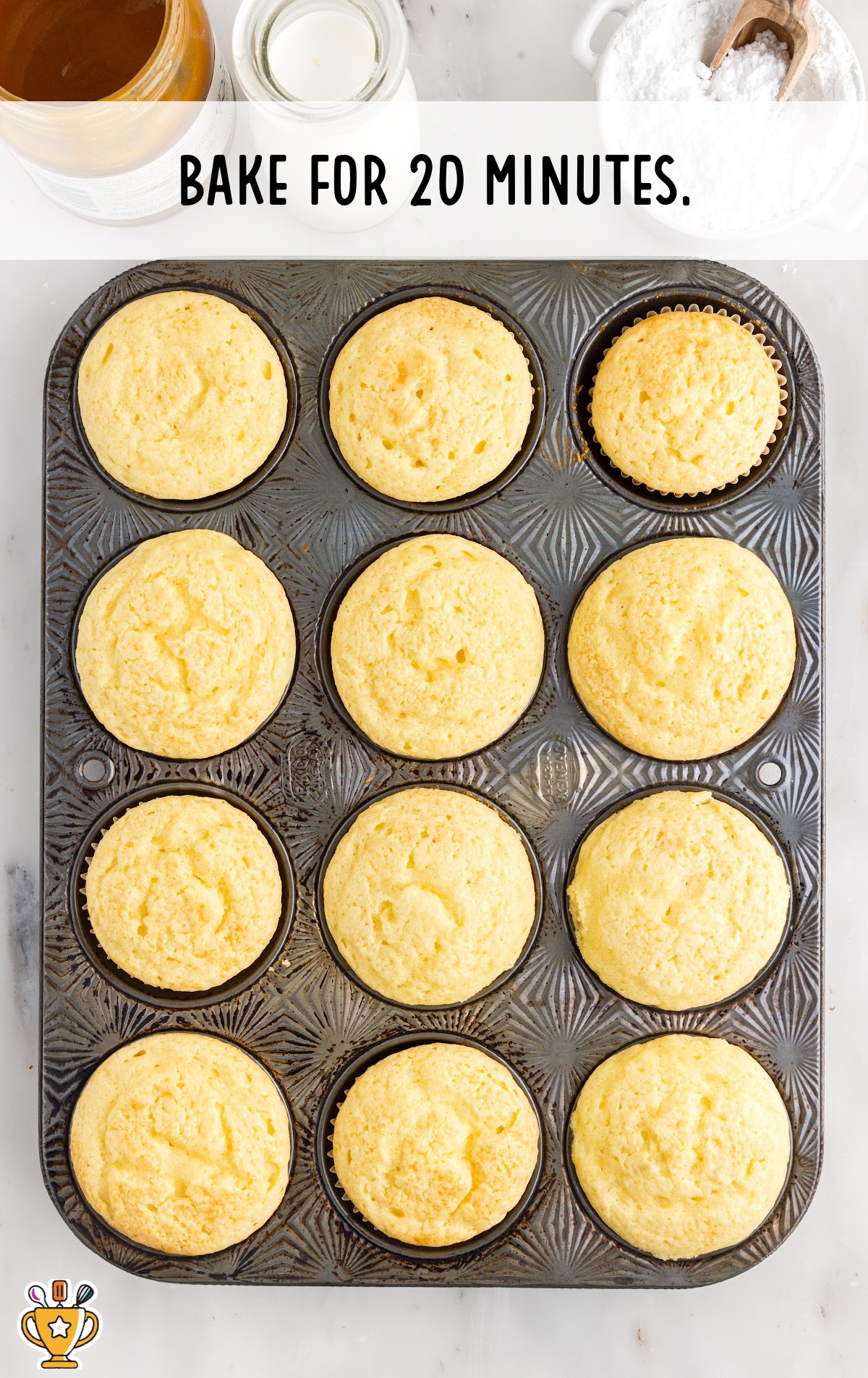 A cupcake tin full of baked cupcakes.