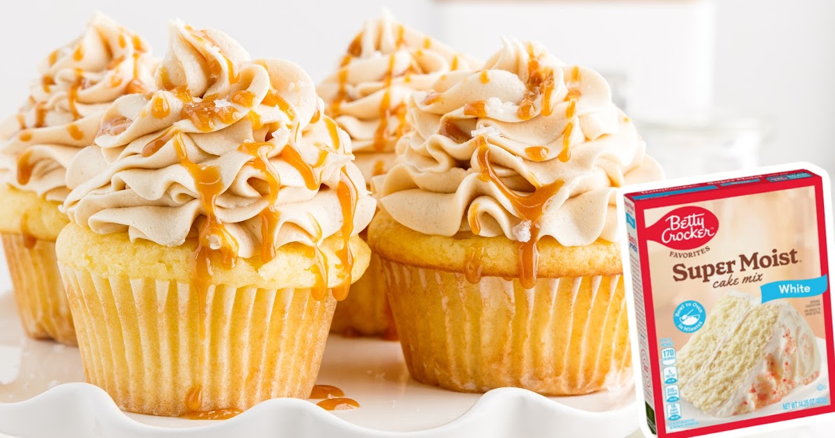a plate of caramel cupcakes topped with caramel frosting and caramel drizzle.