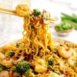 Two sticks holding Shrimp with Ramen