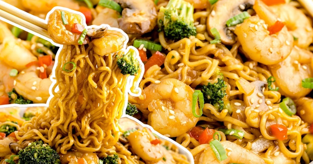 A pot of shrimp with ramen a pair of chopsticks lifting out some