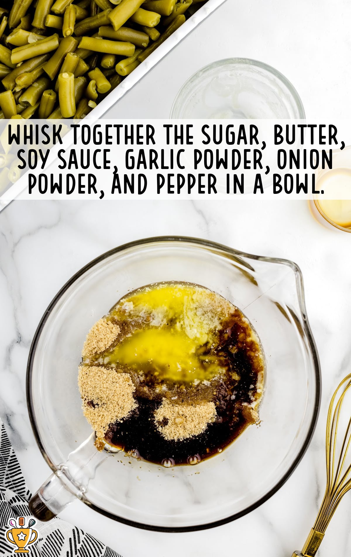 Sugar, butter, soy sauce, garlic powder, onion powder, and pepper in a glass mixing bowl.