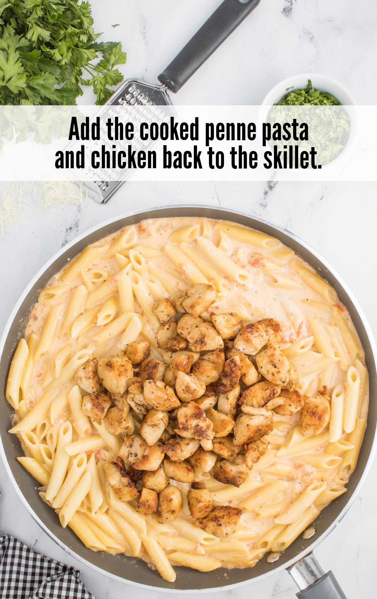 adding cooked penne pasta and chicken into the skillet