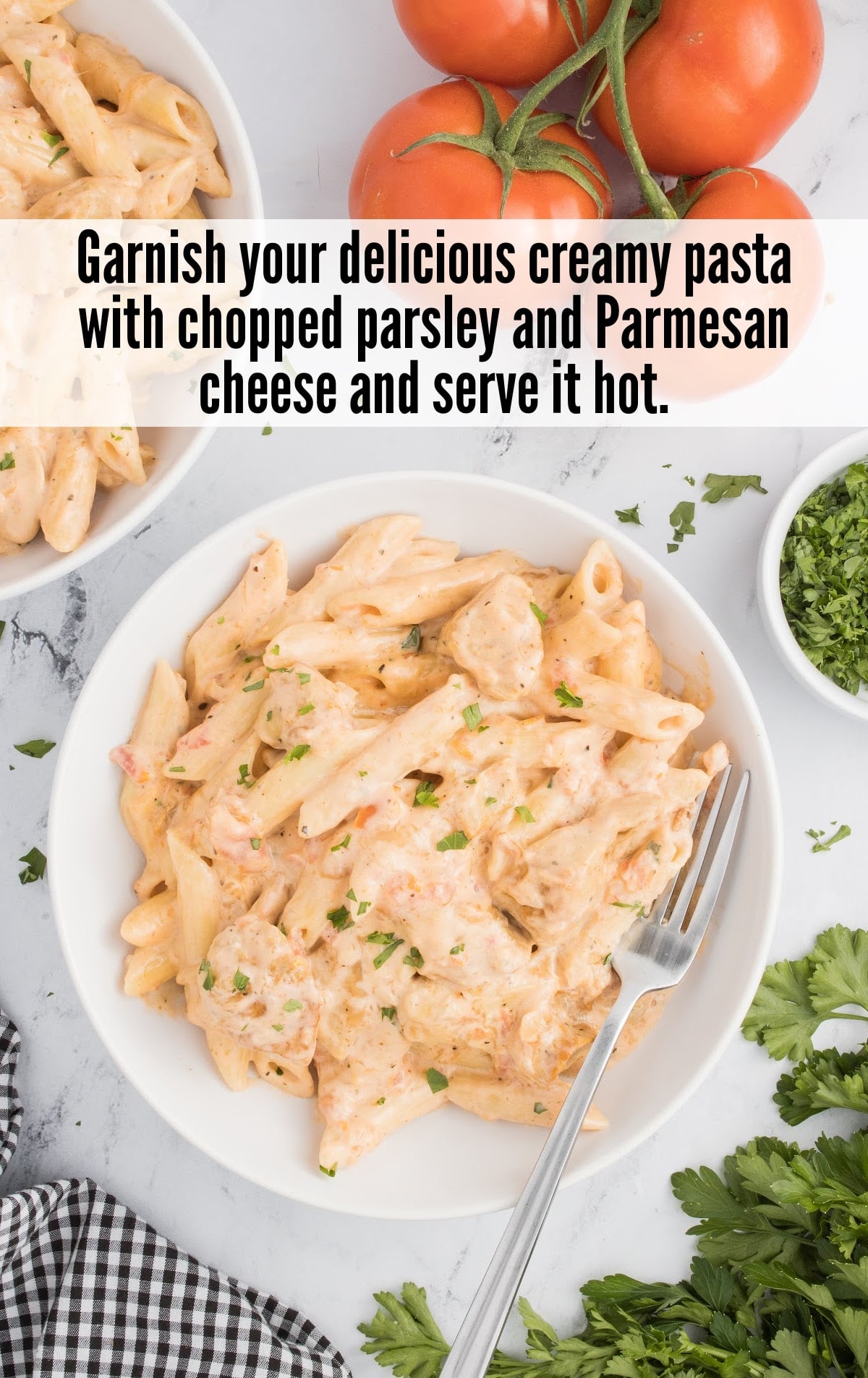 Spicy Chicken Pasta on plate, garnished with chopped parsley and parmesan
