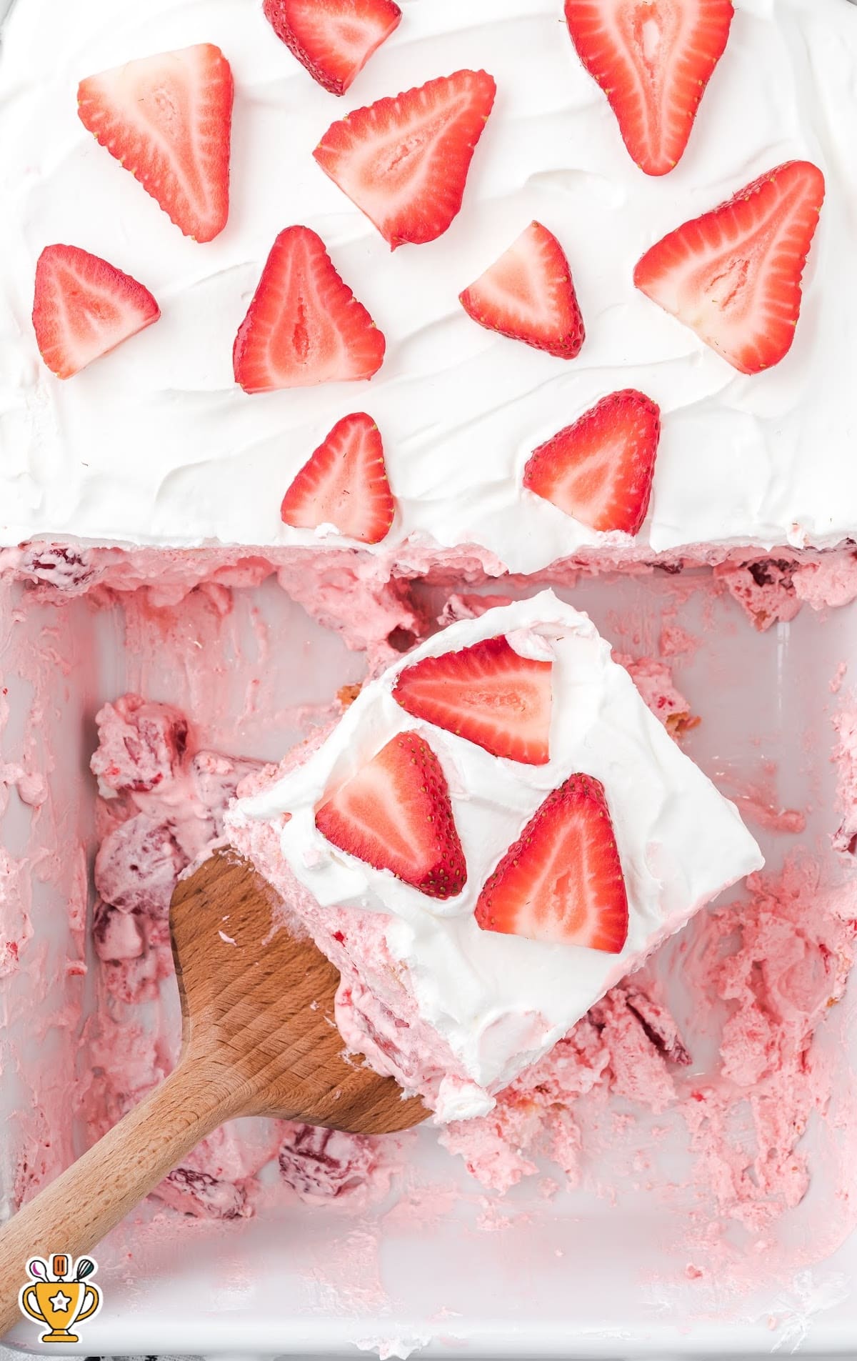 Strawberry Angel Food Cake and a wooden spoon holding some of it