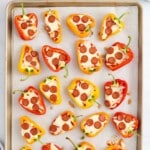 A baking pan covered in Mini Pepper Pizzas.