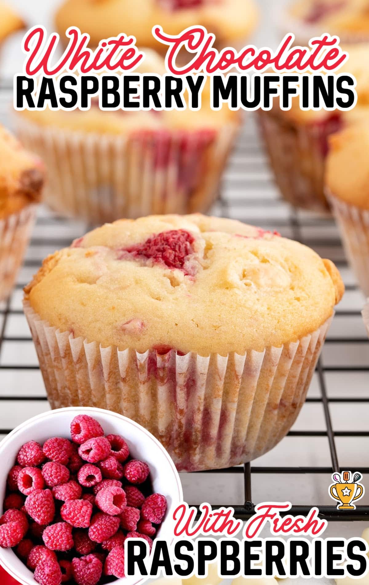 White Chocolate and Raspberry Muffins on a cooling rack.