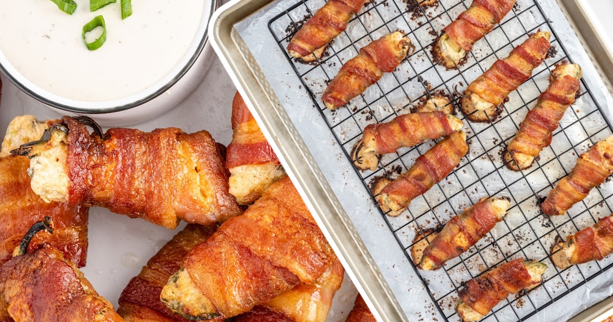 A baking rack of cooked Bacon-Wrapped Jalapeno Poppers