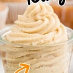 a swirl of caramel icing in a glass cup
