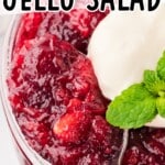 Cranberry Jello Salad in a glass with a spoon