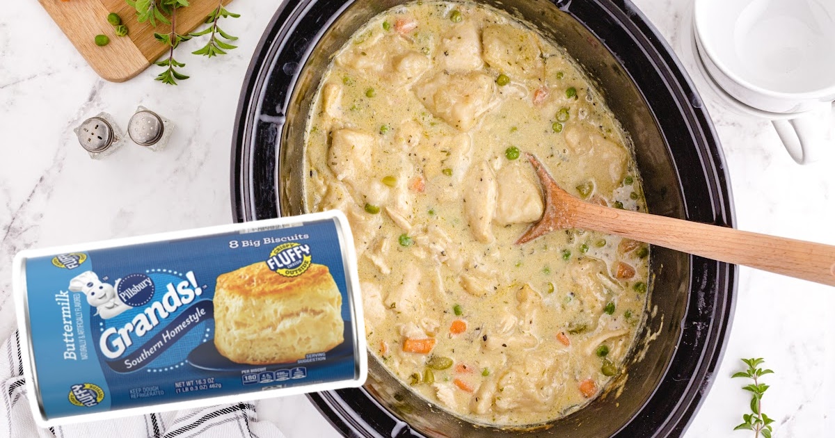 Crock Pot Chicken and Dumplings in a crockpot with a wooden spoon in it