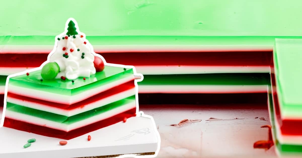 a slice of the jello shots beside a pan of the jello shots.