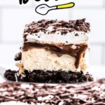 a slice of ice cream cake is lifted from the cake pan.