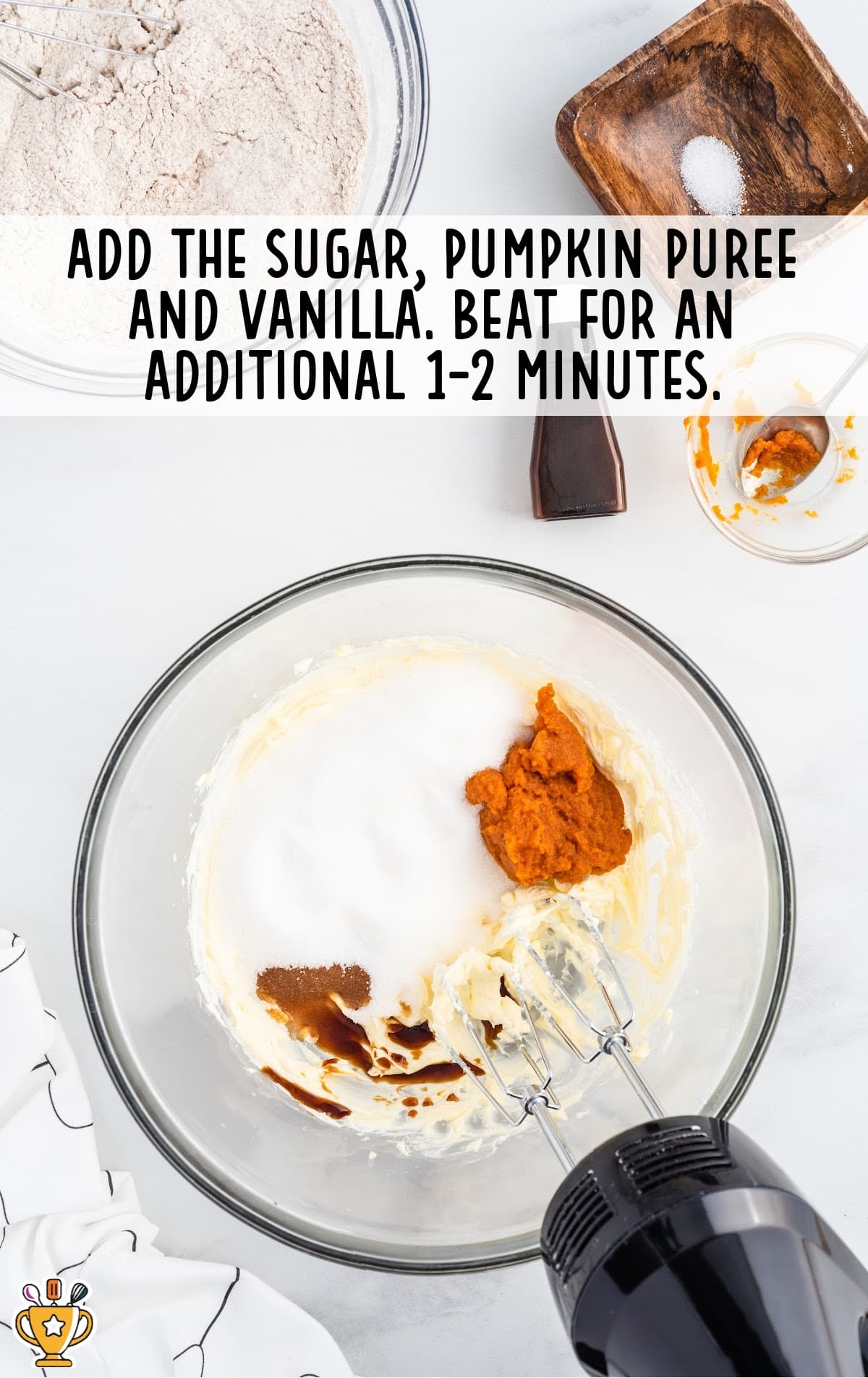 sugar, pumpkin puree and vanilla mixed in a bowl