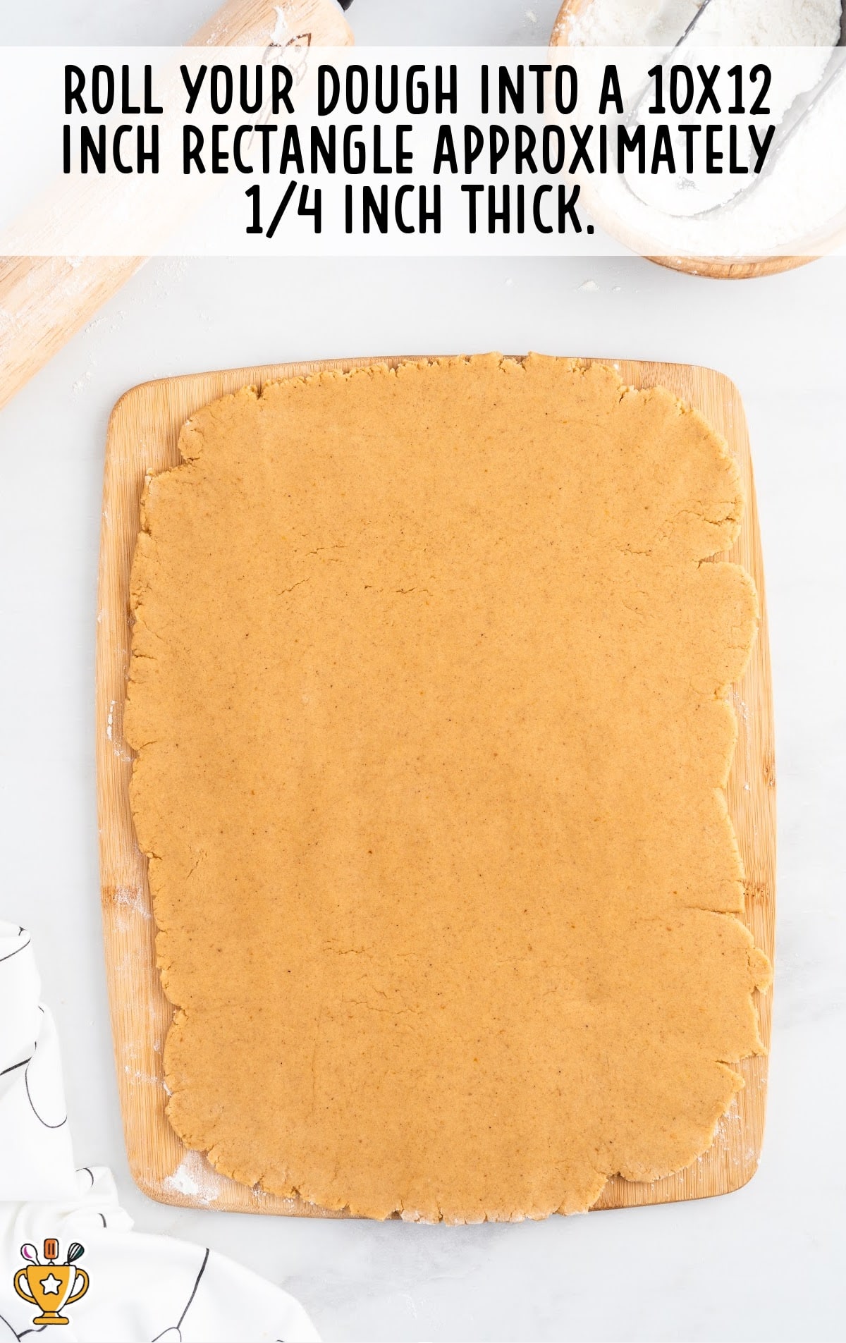 a dough on a wooden board ready to roll