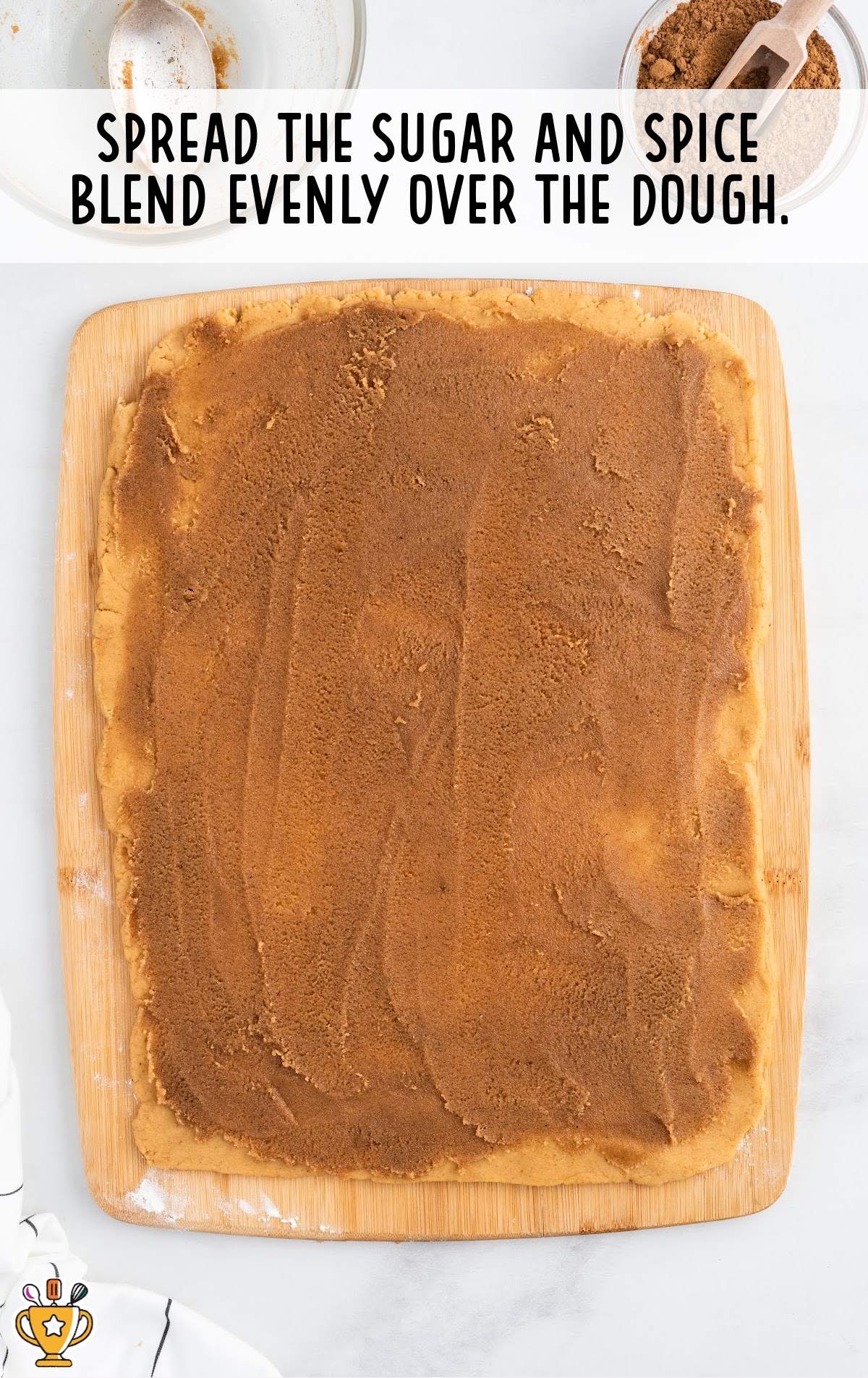 sugar and spice spread over the dough