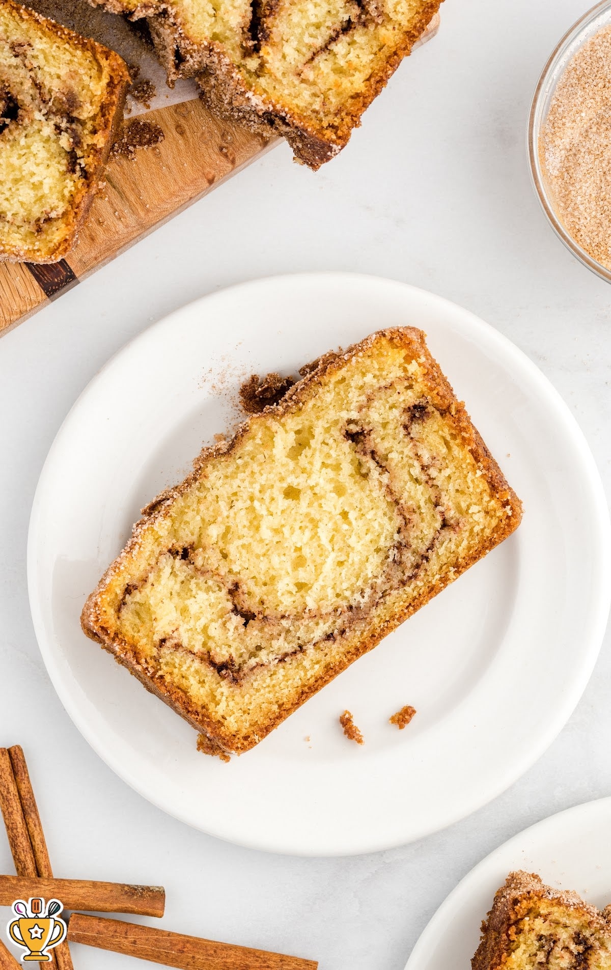 A slice of Snickerdoodle Bread on a white serving bread