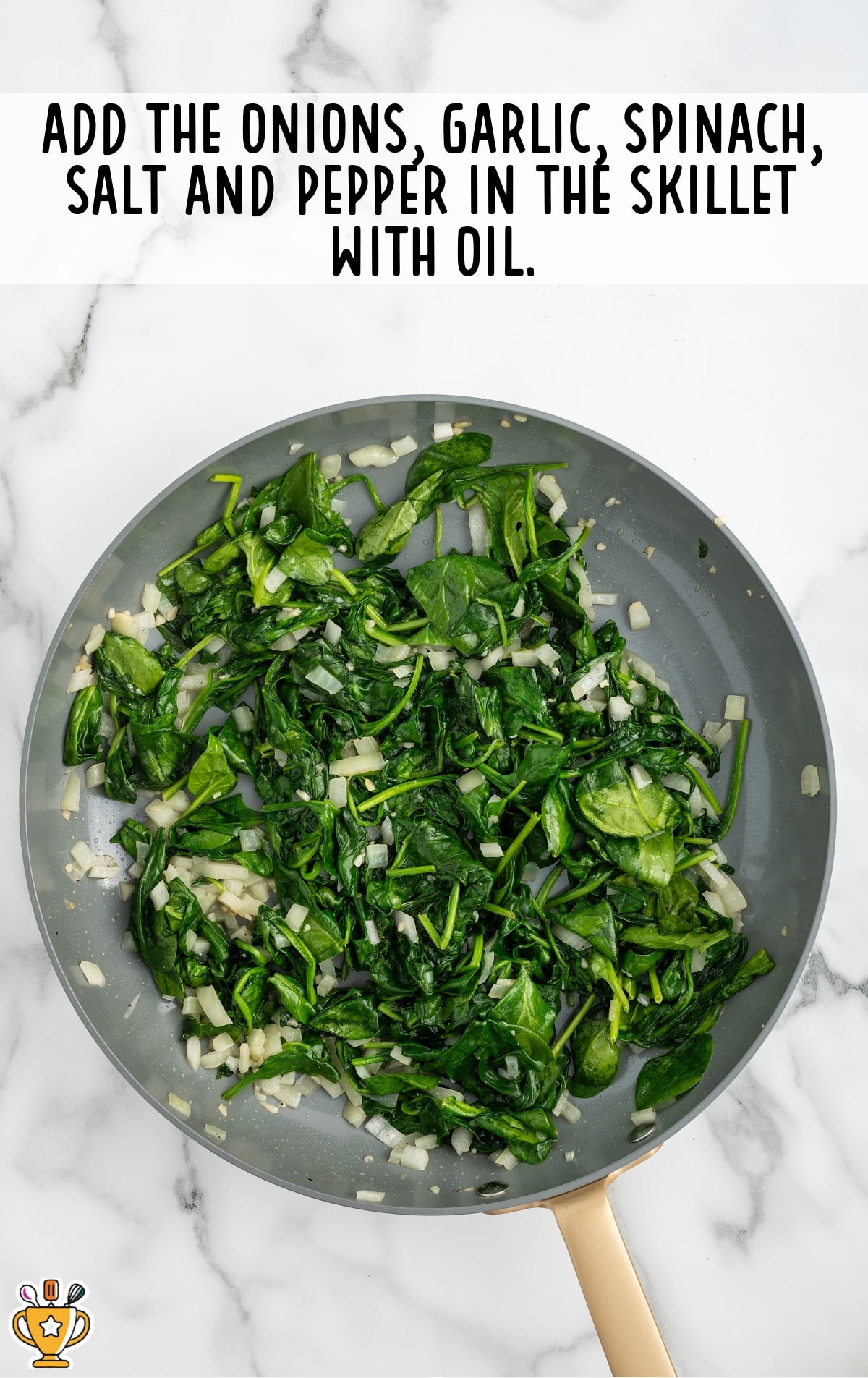 onions, garlic, spinach, salt and pepper added in a skillet