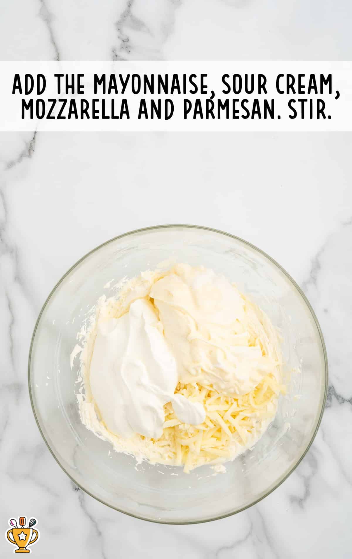 mayonnaise, sour cream, mozzarella and parmesan added in a bowl