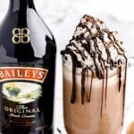 Baileys Hot Chocolate in a mug with a bottle of baileys