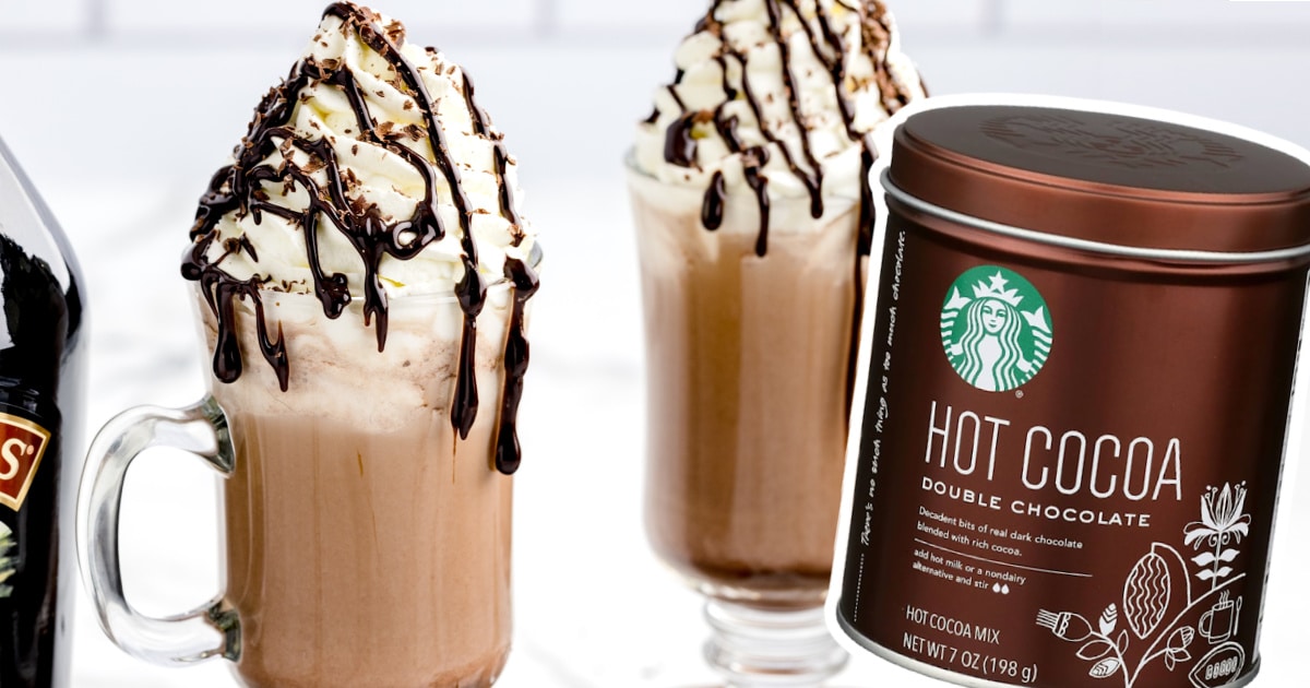 Baileys Hot Chocolate in two mugs and a jar of hot cocoa