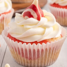 a Candy Cane Cupcake with two others at the back