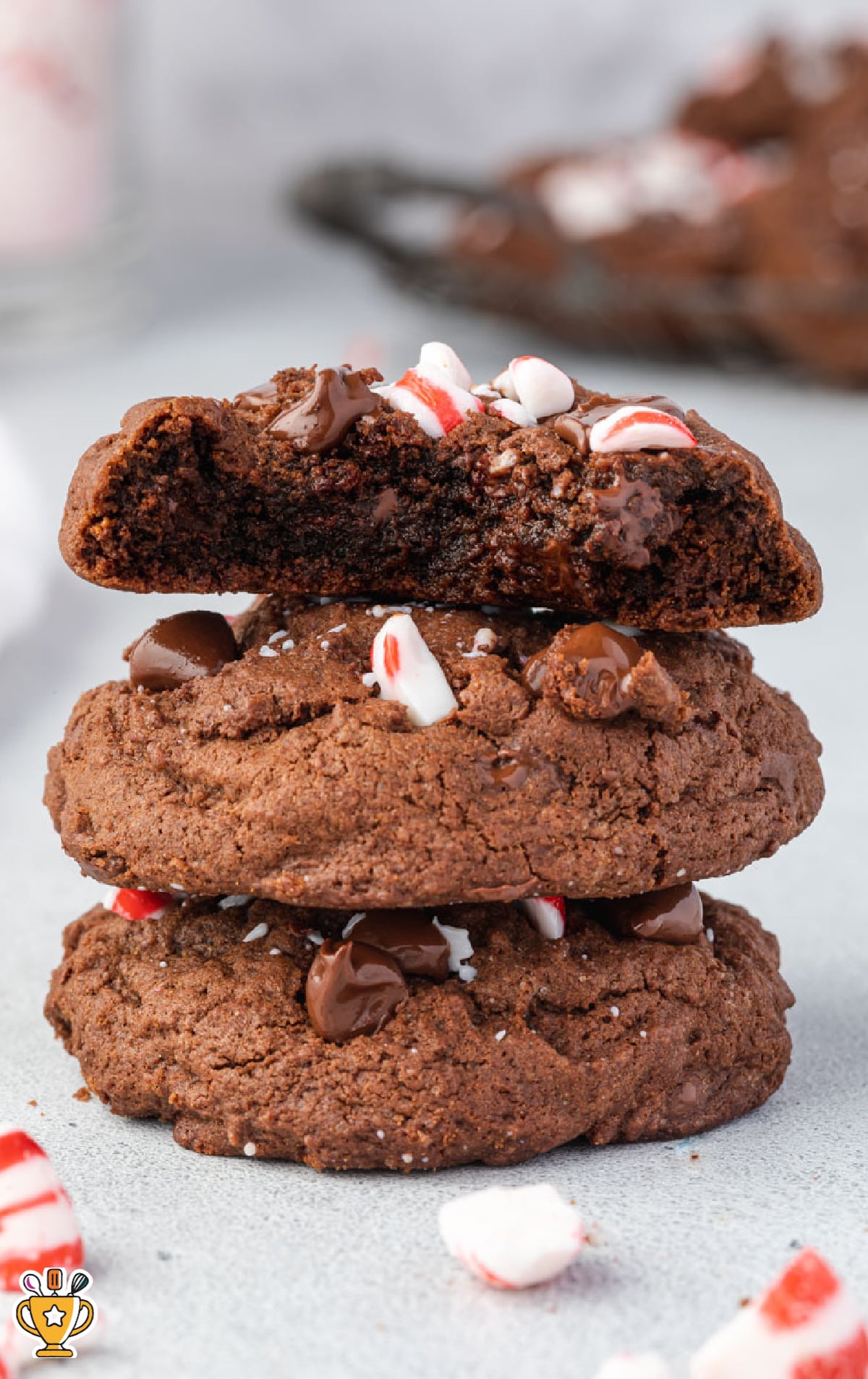 a stack of Chocolate Peppermint Cookies, the top one with a bite on it