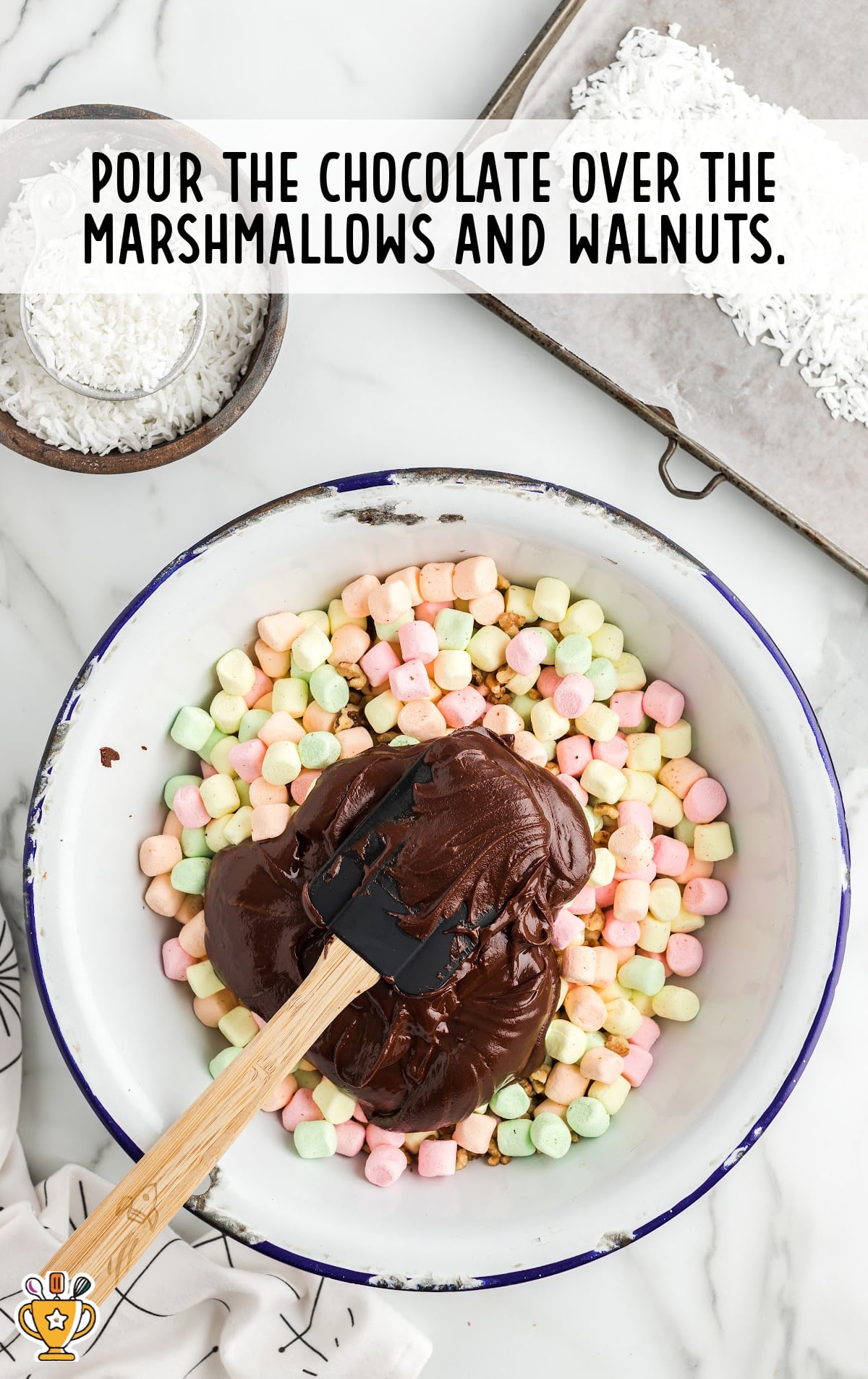 chocolate poured over marshmallow and walnuts