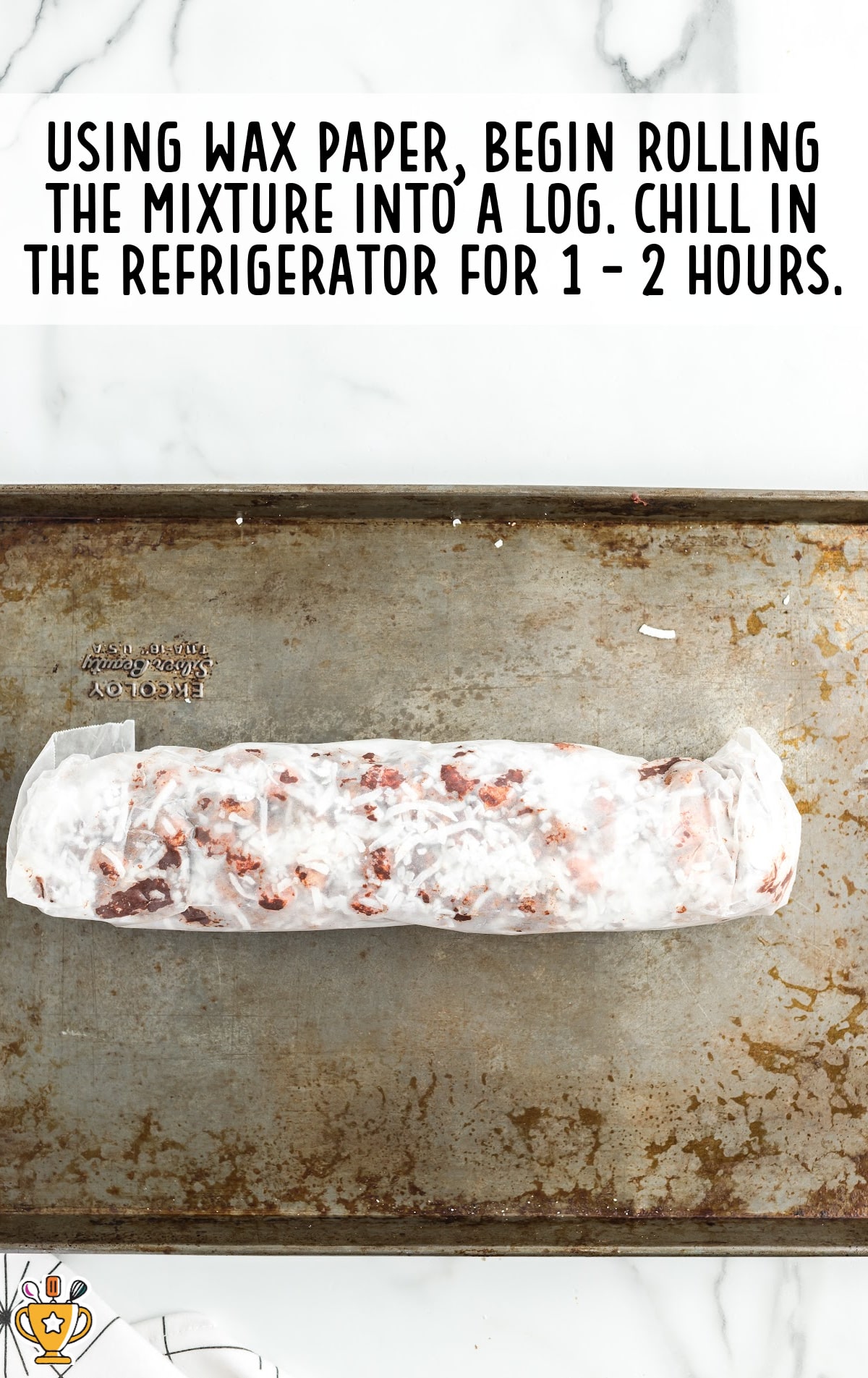 rolling the mixture into a log using wax paper