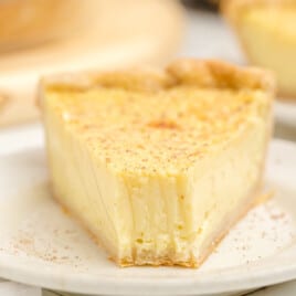 A piece of Custard Pie with a bite out of it.