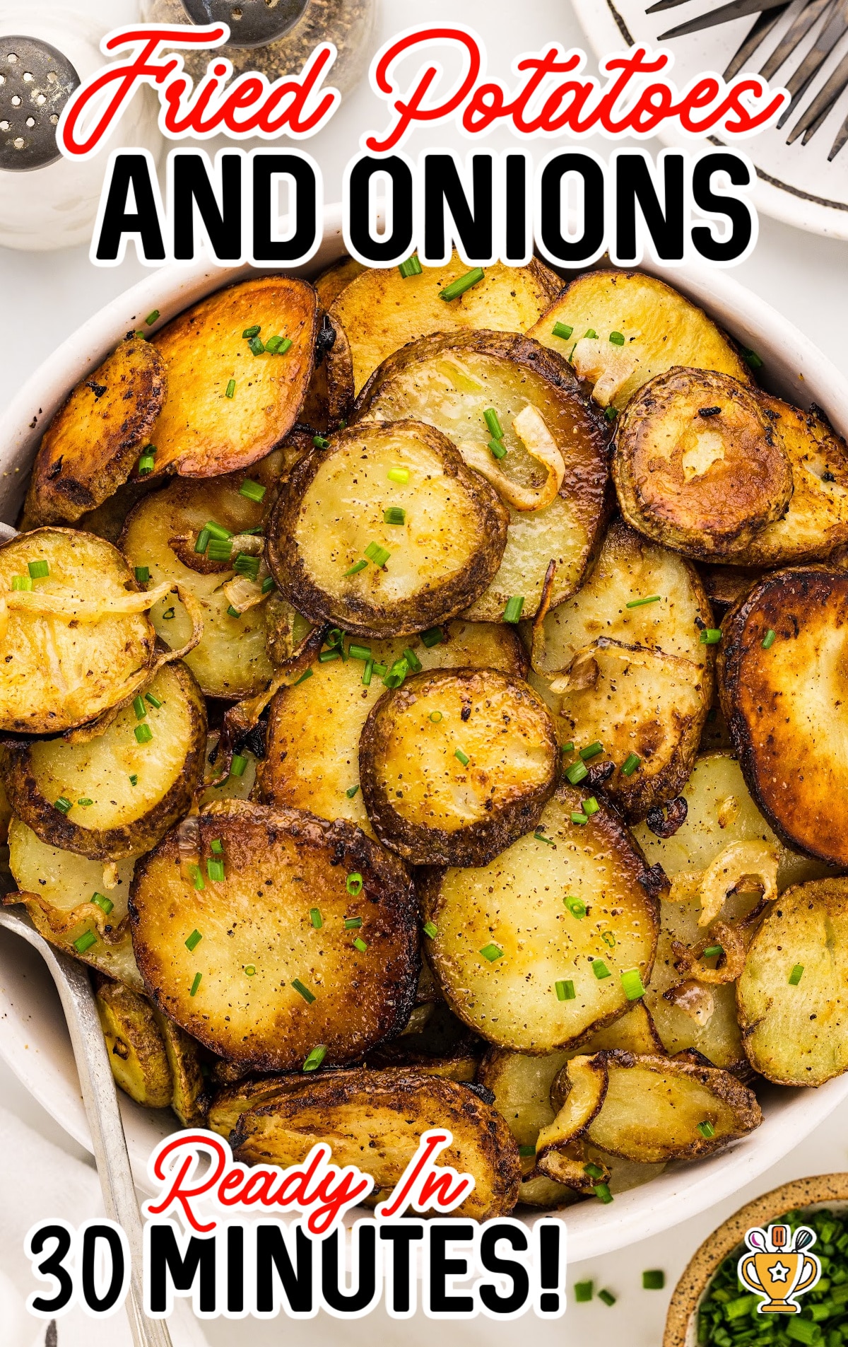 A white serving bowl full of Fried Potatoes and Onions