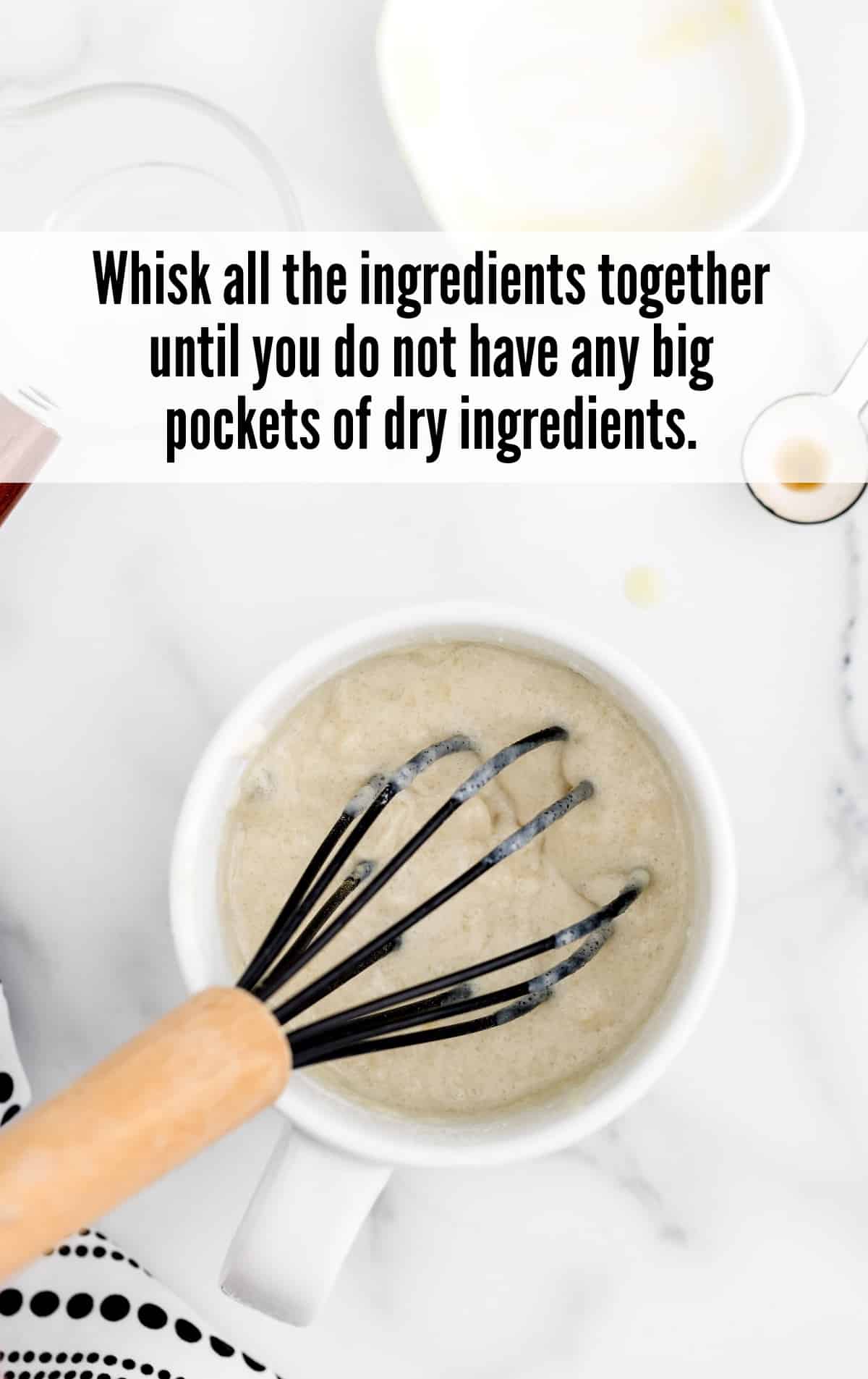 whisking ingredients together in a mug