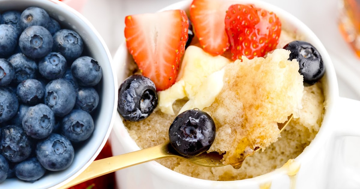 Pancake in a Mug with a bowl of blueberries on the side
