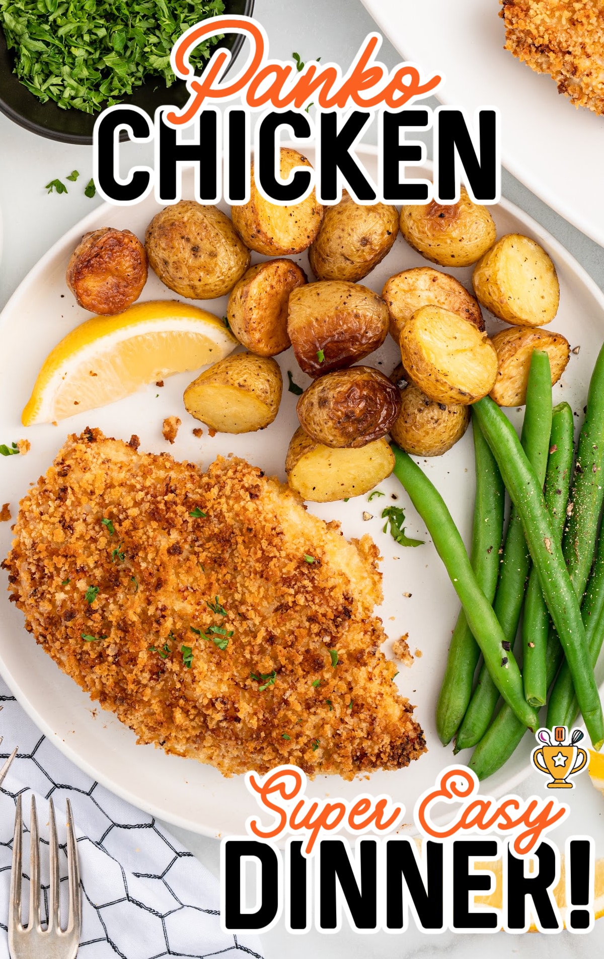 a dinner plate of panko chicken with green beans and potatoes.