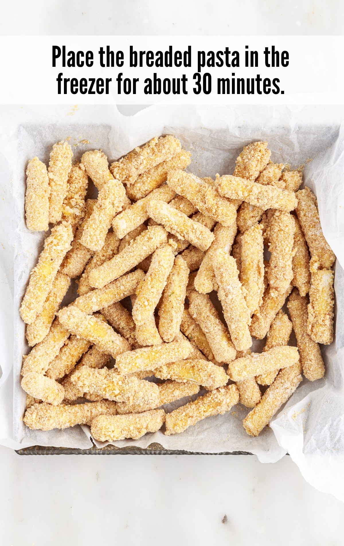 placing the breaded pasta in the freezer