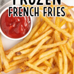 Air Fryer Frozen French Fries on a plate with a sauce in a bowl on the side