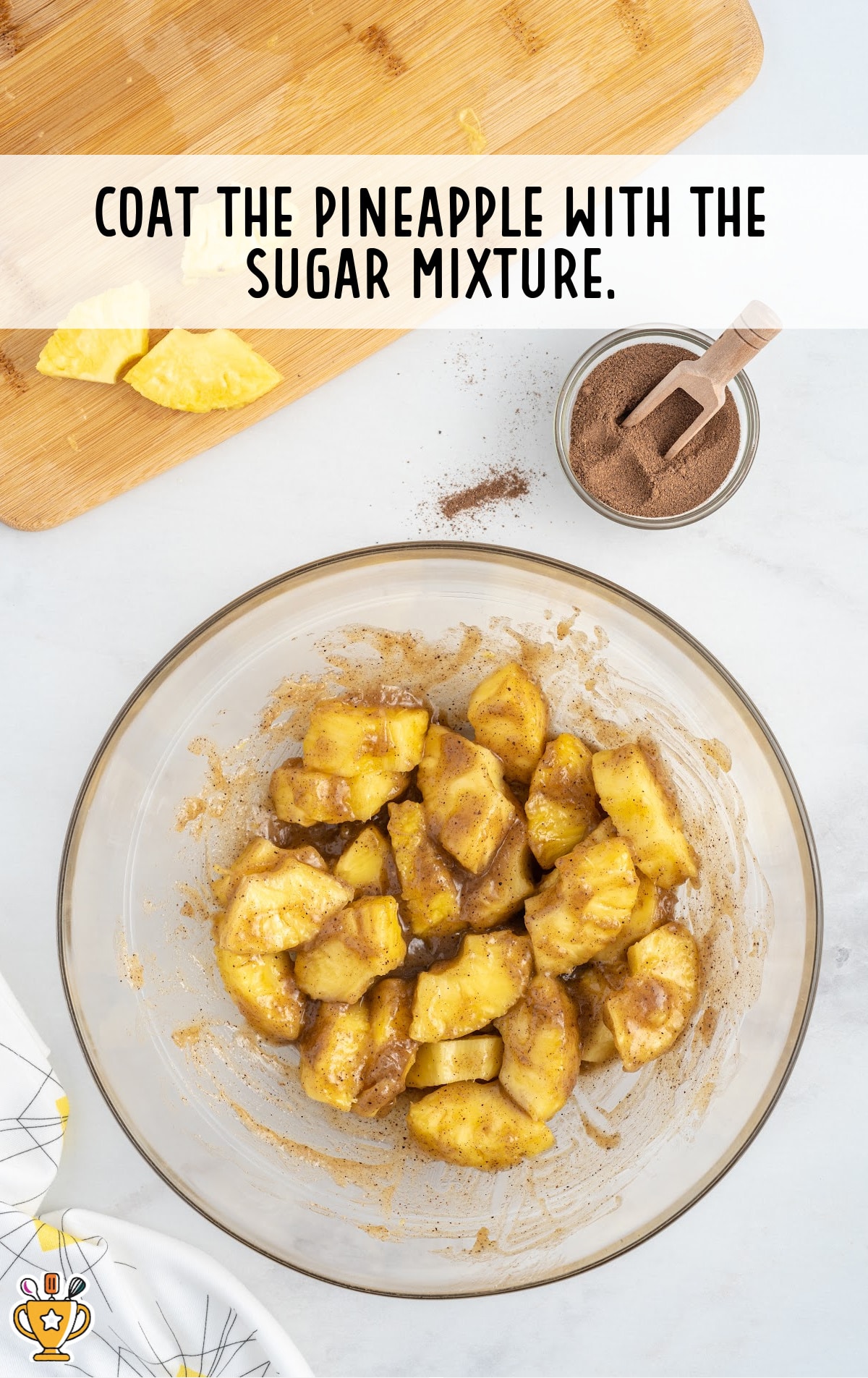 coating pineapples with the sugar mixture in a bowl