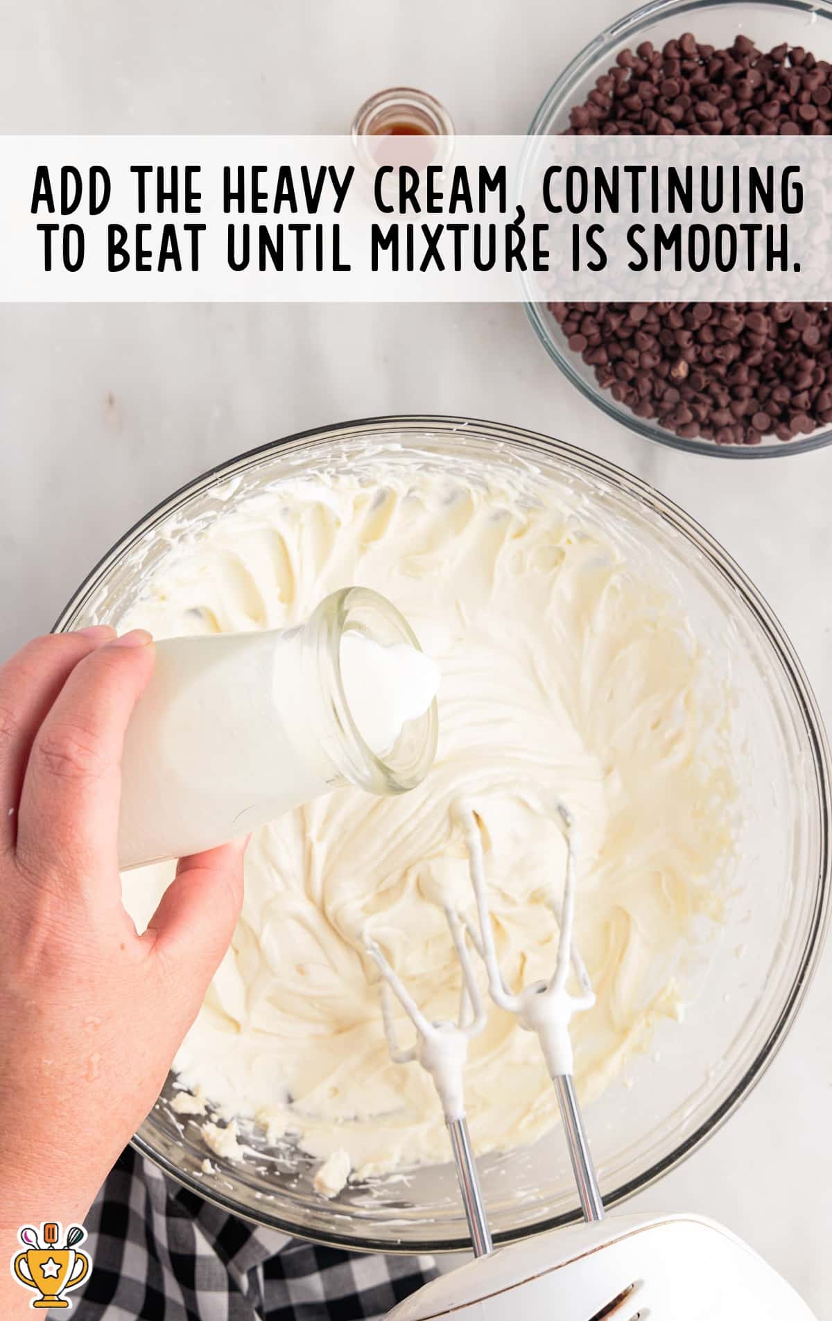 heavy cream added in a bowl with a mixer beating the cream
