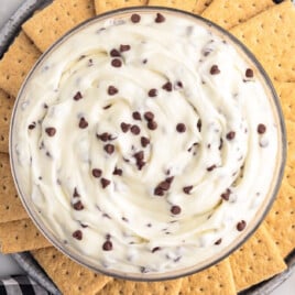 a bowl full of Booty Dip Recipe placed over a plate full of biscuits